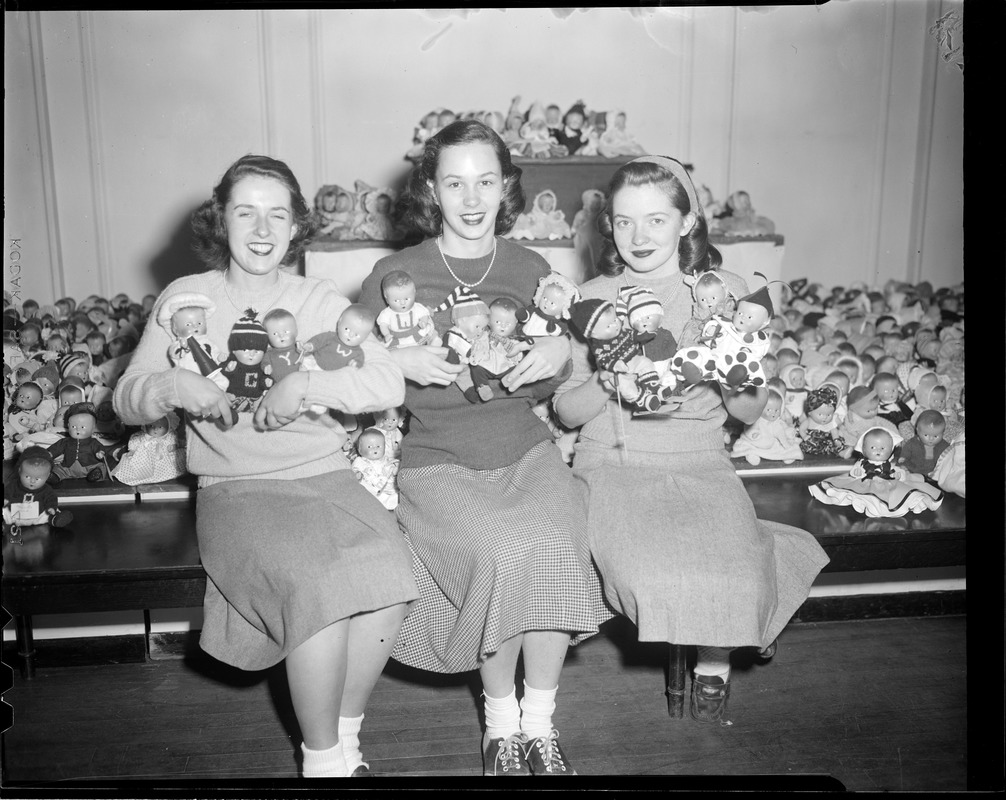 Young women with doll collection
