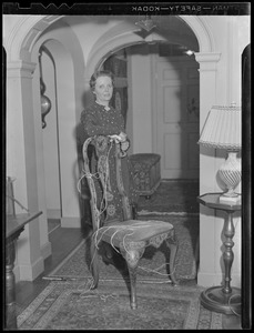 Woman with antique chair