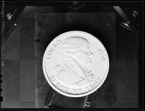 Photograph of both sides of a 1938 nickel