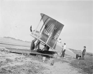 Men working on sea plane