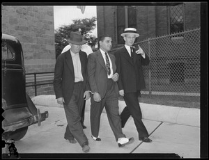 Parolee Raymond Patriarca, arrested in hold up, court officer James E. Desmond in straw hat