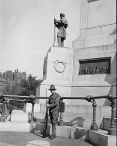 Militiaman guards Soldiers & Sailors monument, during police strike