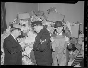 Police inspect pile of clothes