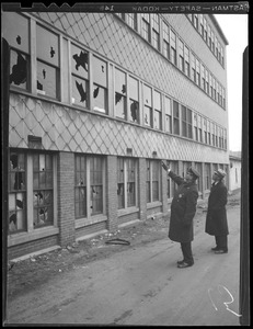 Police inspect damage by rioting strikers at the B.E. Cox Leather Factory in Peabody