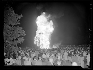 Crowd watches bonfire