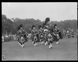 Troop of bag pipers perform on Green