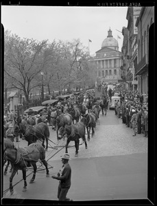 Team of horses pull wagon down Park Street