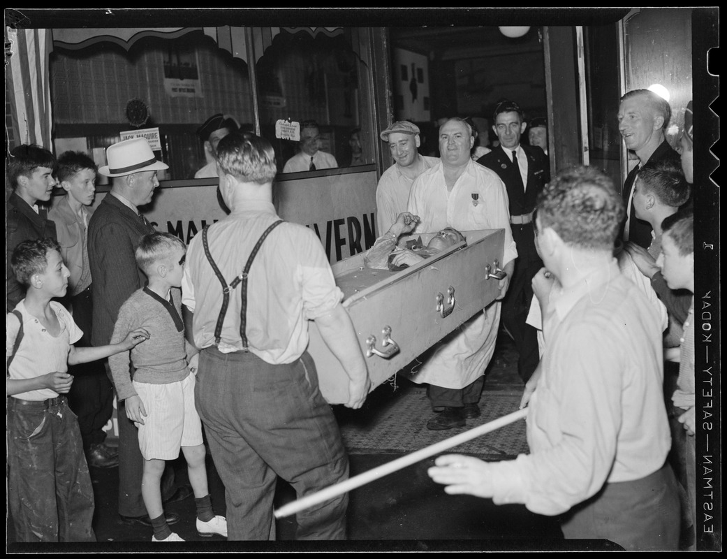 Man smoking cigar carried in coffin when American Legion came to town