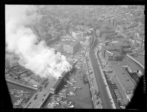 Aerial view of fire near Warren St. Bridge showing Charlestown city square