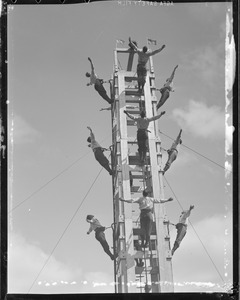 Fire men's ladder acrobatics