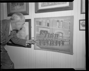Man examines old fire dept. photograph