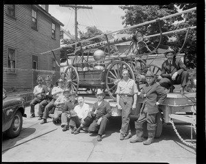 Firemen pose with old fire engine Columbia