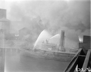 Fireboat engine #44 fighting wharf fire