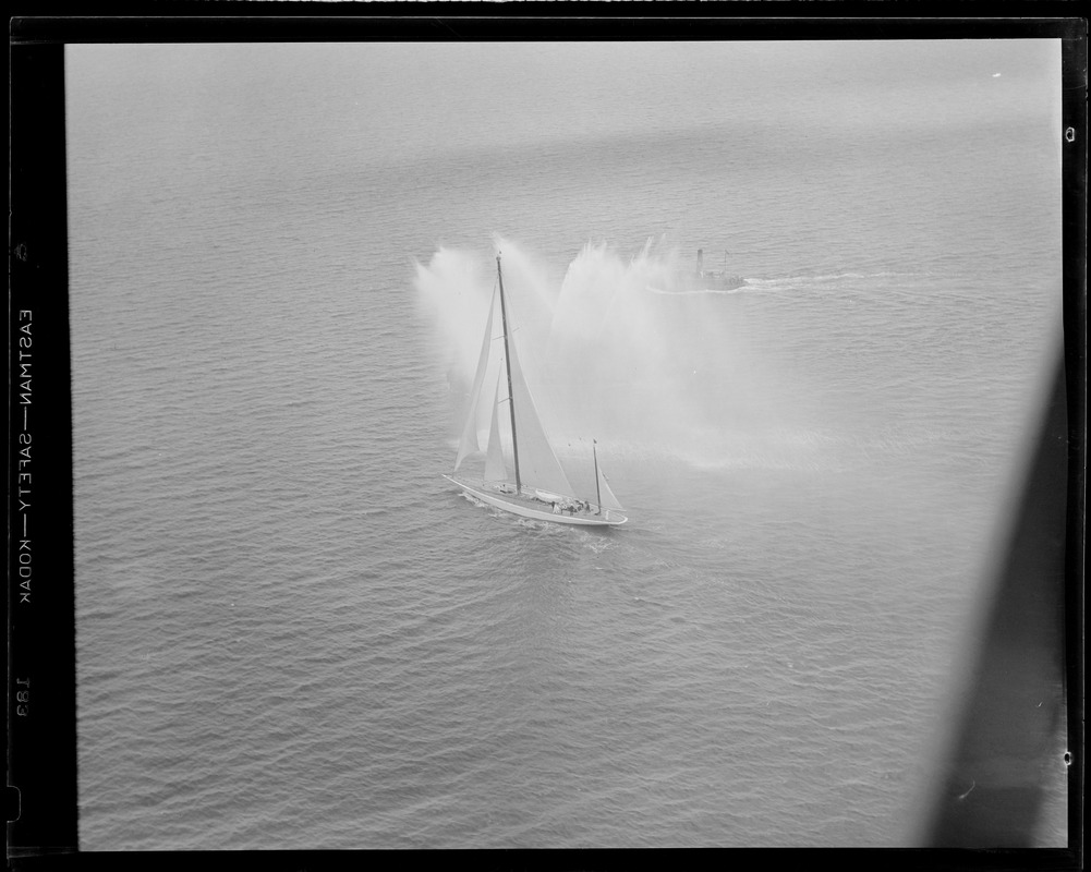 Sailboat - plume of water. Fireboat.