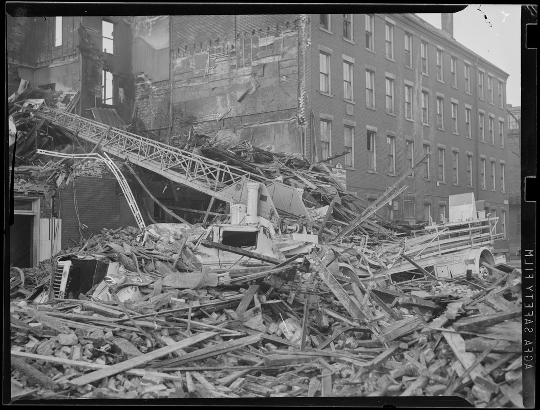 Ladder truck buried in rubble, Maverick Sq. fire, East Boston