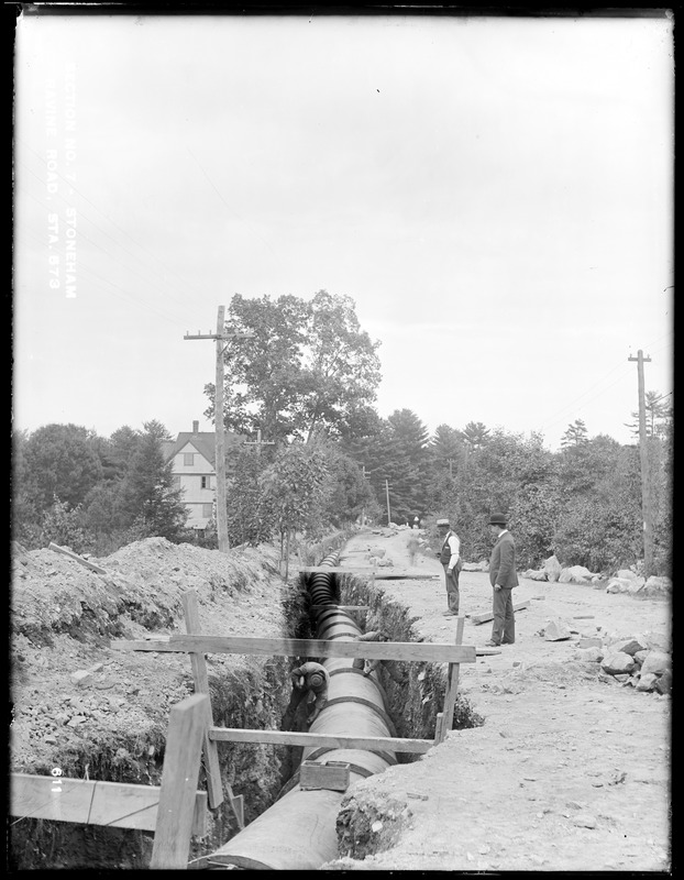 Distribution Department, Low Service Pipe Lines, Section 7, trench work, Ravine Road, station 573, from the west, Stoneham, Mass., Sep. 15, 1896