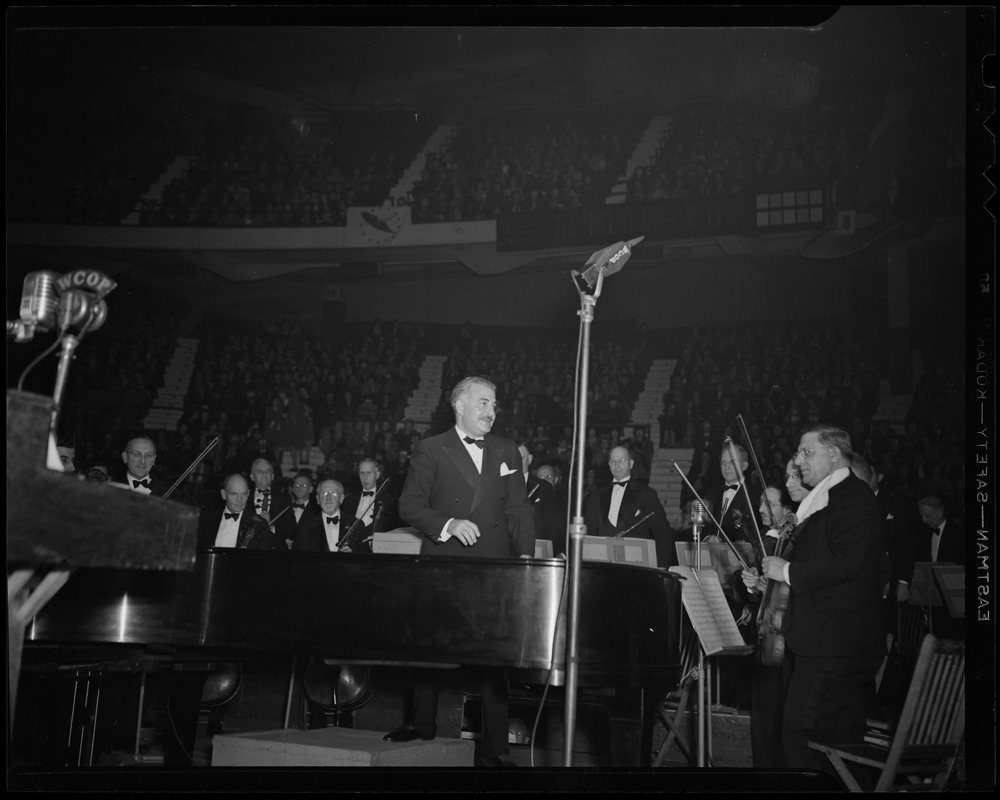 Arthur Fiedler and musicians on stage at Greater Boston United War Fund rally at Boston Garden