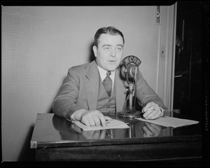 Jack Malloy speaking into WCOP microphone