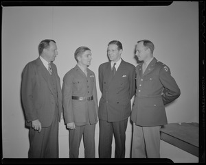 Frederic C. Church, Jr., Pfc. Hy Rosen, Boston Mayor Maurice Tobin, and Col. George A. Ford at a Victory Volunteers induction ceremony at Jordan Marsh Co. Auditorium