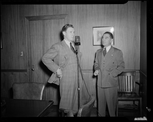 George Murphy at microphone in an office