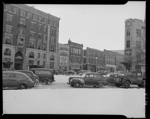 Street scene with Yankee Network letter board sign advertising Yankee Network News Service on WNAC sponsored by Suffolk Farms Salad Bowl