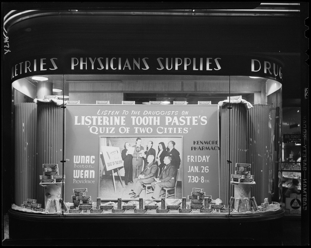 Display for Quiz of Two Cities on WNAC sponsored by Listerine Tooth Paste in window of Kenmore Pharmacy