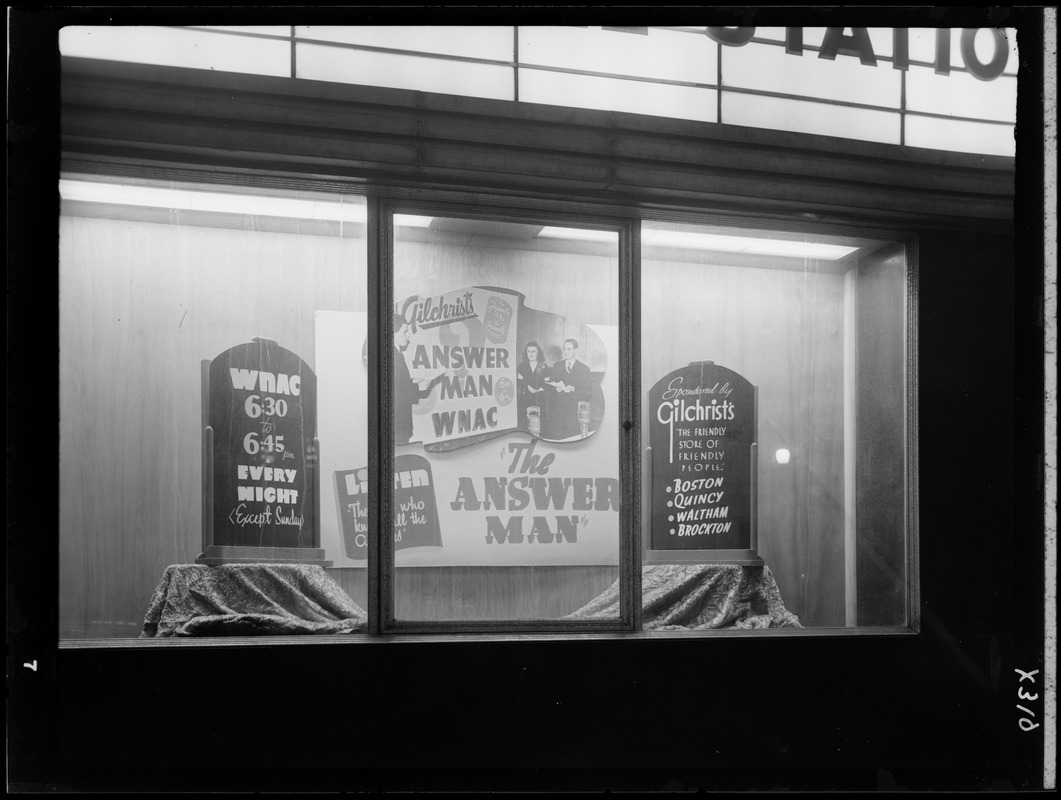 Window display advertising The Answer Man on WNAC sponsored by Gilchrist's