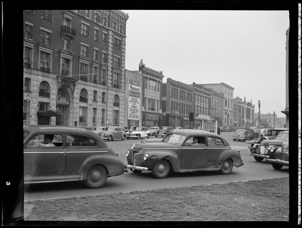 Street scene with Yankee Network letter board sign advertising Flit Frolics on WNAC sponsored by Flit Insecticides