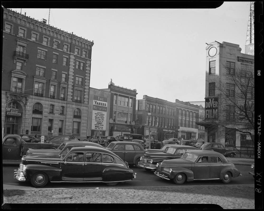 Street scene with Yankee Network letter board sign advertising Tello-Test with Fred Lang on WNAC sponsored by Jenney Gasoline Dealers