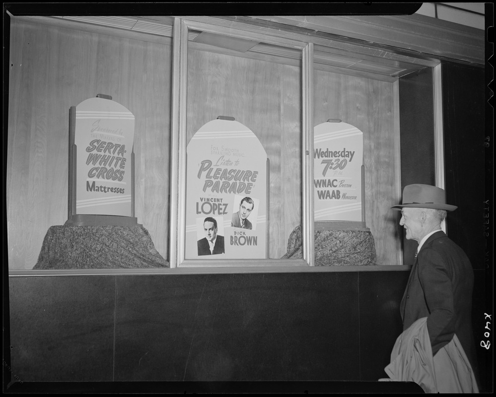 Window display for Pleasure Parade on WNAC sponsored by Serta White Cross mattresses Digital