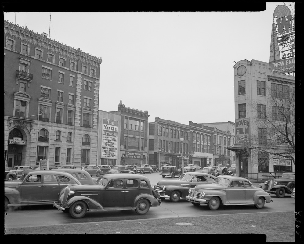 Street scene with Yankee Network letter board sign advertising Yankee Network News Service sponsored by Durkee-Mower's Marshmallow Fluff and Sweeco
