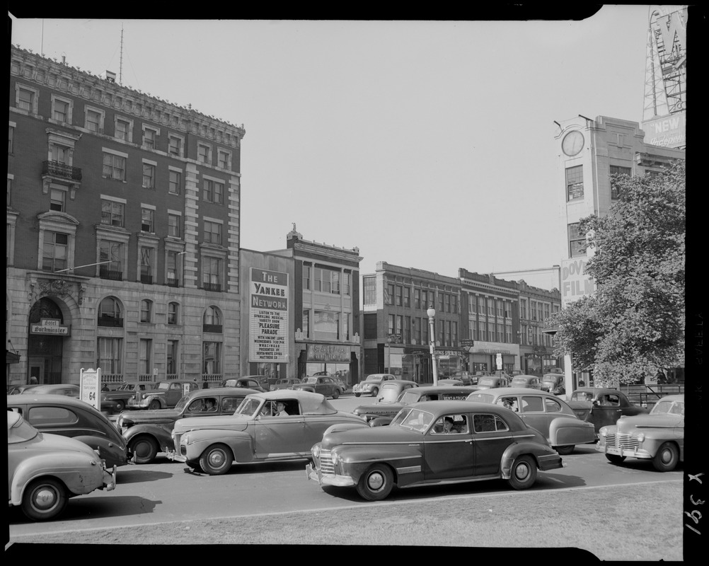 Street scene with Yankee Network letter board sign advertising Pleasure Parade on WNAC sponsored by Serta White Cross Mattress co.