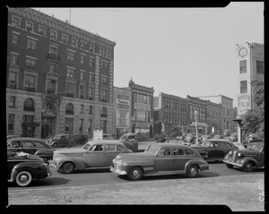 Street scene with Yankee Network letter board sign advertising Boston Blackie on WNAC sponsored by The M. A. Hanna Co. and Atlantic Coal Company