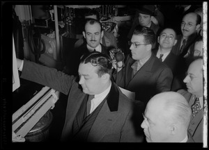 Russell Offhaus of WCOP reporting from a factory surrounded by crowd