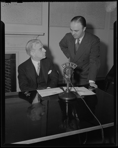 Two men at WRUL microphone