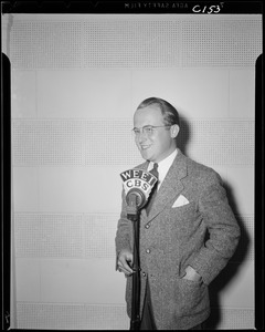 Unidentified man and at WEEI microphone