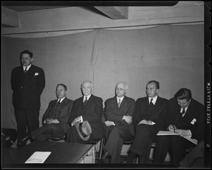Five seated men