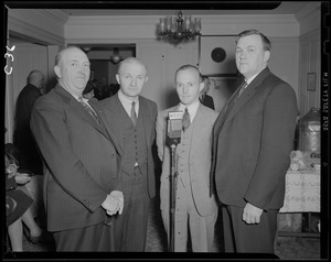Group of unidentified men at WEEI microphone