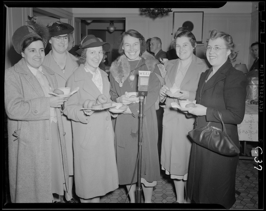 Group of unidentified women at WEEI microphone