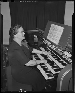 WEEI, woman, possibly Doris Pirell, at organ