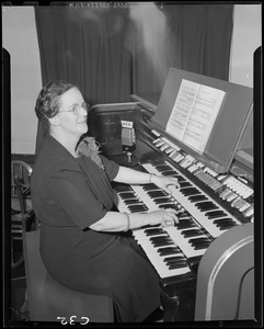 WEEI, woman, possibly Doris Pirell, at organ