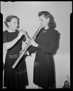Women playing pipes