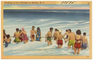 Holding on for a breaker at Belmar, N. J.
