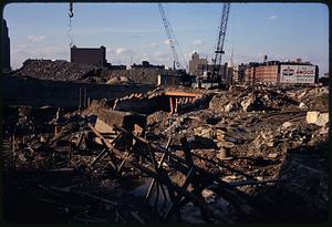 Rubble at construction area with buildings in background, Boston