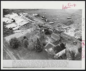 Farm Where Three Died--This aerial view shows the devastation on the John Butak farm near here in which three members of his family were killed when the barn (top left) collapsed when hit by a tornado last night. Killed were Butak's wife, Irene, 37, and his two children, William, 15, and Lillian, 10. He escaped. At least 18 persons were killed.