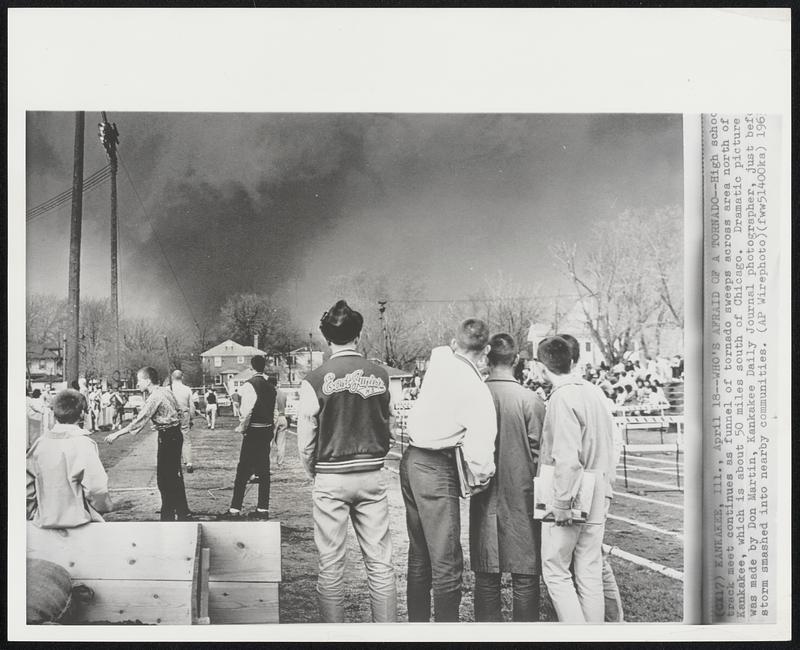 Who's Afraid of a Tornado--High school track meet continues as a funnel of tornado sweeps across area north of Kankakee, which is about 50 miles south of Chicago. Dramatic picture was made by Don Martin, Kankakee Daily Journal photographer, just before storm smashed into nearby communities.