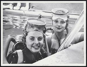 Betty Porter, left Elaine Karrol, at pool's edge after lesson in use of SCUBA (Self Contained Underwater Breathing Apparatus)