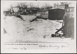 Main St. bridge being swept away by flood waters