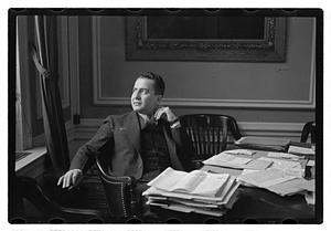 A man seated at a desk