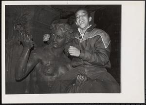 Raymond Cordova posing on Brewer Fountain in the Boston Common